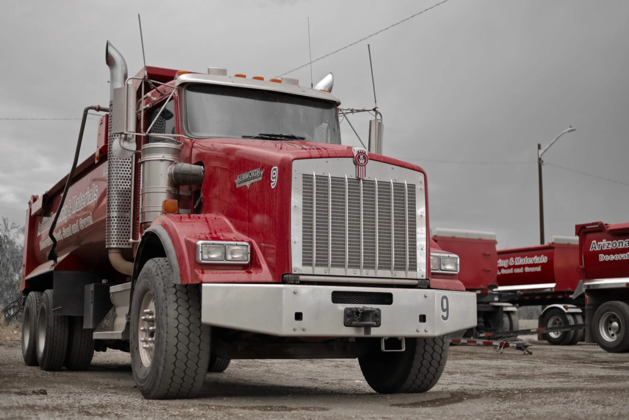 Loader filling a truck with decorative rock at the Arizona Trucking & Materials yard