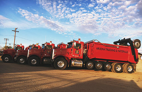 Arizona Trucking & Materials offers large truck rentals to move your rocks, sand, gravel and other landscaping materials. Our truck rental options range from flat bed trucks to large, 18-wheel, 25-ton dump trucks.